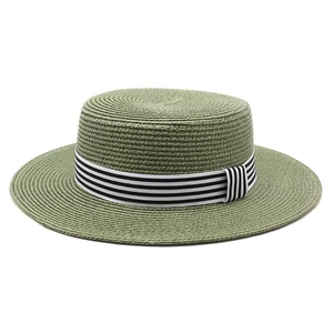 Green straw boater hat for women with a black and white striped ribbon for summer beach
