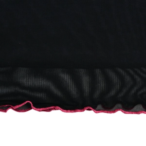 Detail of black mesh fabric with pink lettuce edge hem on a bodycon mini dress