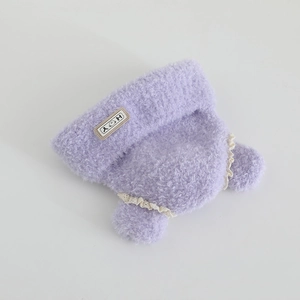Detail of purple plush girl winter hat with white lace trim and HOY smile label