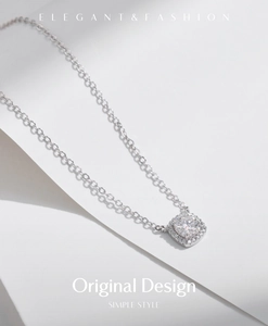 Close-up of elegant square silver pendant with brilliant round-cut moissanite stone