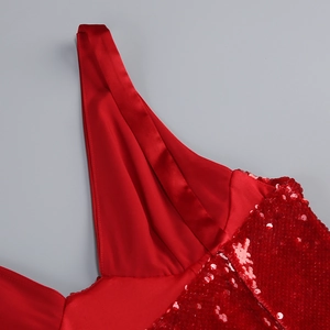 Detail of red sequins and satin stitching on the V-neck evening gown strap and bodice