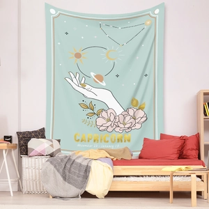 Detail of Capricorn zodiac tapestry with gold print in a cozy bedroom setting