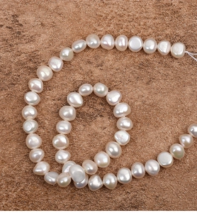 Macro detail of 9-10mm baroque freshwater pearls with natural iridescent luster