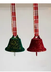 Close-up of red and green glitter Christmas bells with red and white plaid ribbons