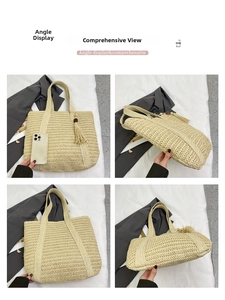 Detail view of large beige woven straw tote bag with decorative wooden bead tassel charm
