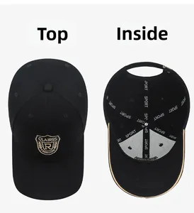 Detailed view of black baseball cap with shield embroidery and internal sport reinforcement