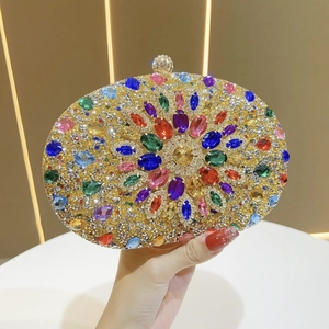 Detail of luxury evening clutch bag featuring colorful rhinestones and floral pattern