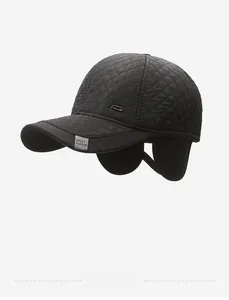 Detail of winter baseball cap featuring ear protection and quilted windproof fabric