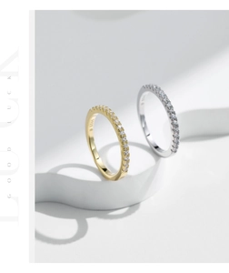 Detail of silver and gold eternity rings with S925 hallmark and shimmering cubic zirconia