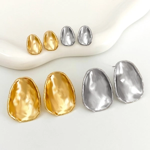 Irregular waterdrop stud earrings in gold and silver colors with two size variations