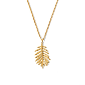 Detailed view of a gold leaf pendant necklace with fine chain on white background