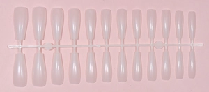 Detail of long ballerina press-on nails in translucent nude pink with glossy UV finish