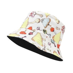 Reversible bucket hat with colorful mushroom print on white background and black lining