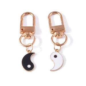 Vintage Tai Chi Yin Yang couple keychain set in gold-tone metal with black white enamel