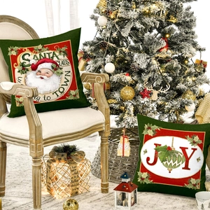 Christmas pillow covers with Santa Claus and Joy prints in festive red and green colors