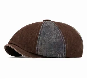 Detailed side view of two-tone washed denim newsboy cap in coffee and blue-grey fabric