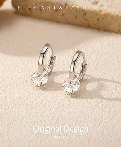 Macro view of 925 silver hoop earrings with a sparkling 1 carat round moissanite stone