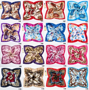 Detailed grid of 16 square satin scarves with diverse paisley and geometric patterns
