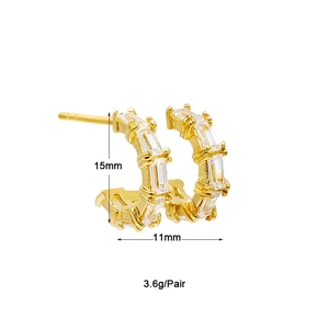 Detail view of gold earrings with cubic zirconia and dimensions 15mm by 11mm