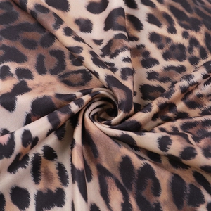 Macro shot of high-quality leopard print fabric showing soft texture and textile details