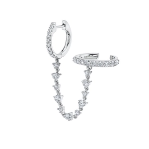 Detail of S925 silver ear cuff and hoop earring connected by a sparkling diamond chain