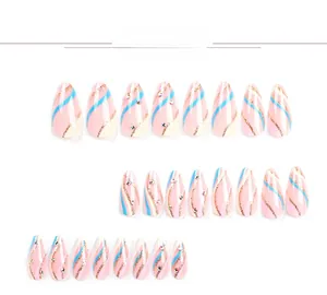 Macro view of almond press-on nails with blue fluid lines, gold glitter and small rhinestones