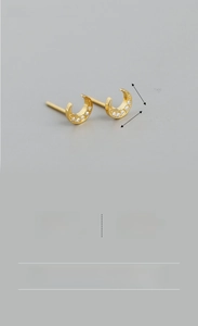 Detailed view of S925 sterling silver moon stud earrings with zircon inlay
