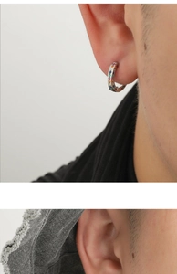 Close-up of rainbow cubic zirconia earrings in silver setting worn by a model