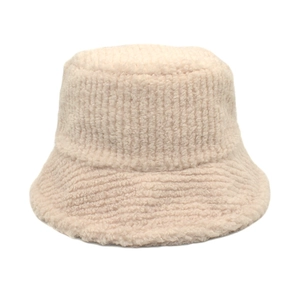 Macro detail of beige corduroy stripe texture and soft fleece lining on bucket hat