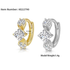 Macro view of S925 sterling silver hoop earrings featuring square cubic zirconia stones
