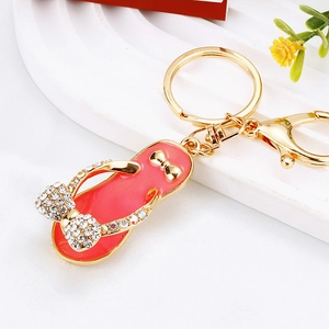 Close-up of pink flip-flop keychain with rhinestones and gold lobster clasp