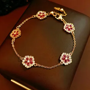 Elegant 18k gold plated flower bracelet with ruby-red stones and zircon crystal accents