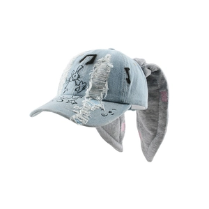 Distressed blue denim baseball cap with long plush rabbit ears and graffiti embroidery