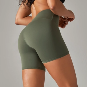 Detail view of high-waist army green yoga shorts showing seamless texture and lift effect