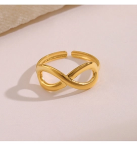 Detailed view of the gold infinity symbol ring with an adjustable open design