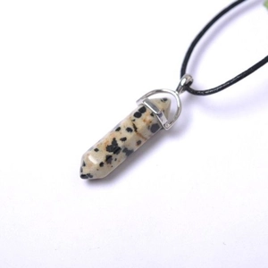 Macro shot of Dalmatian Jasper hexagonal pillar pendant with black cord necklace
