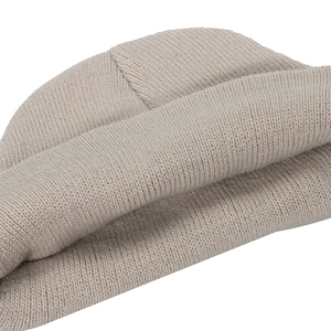 Macro shot of tight knit oatmeal beanie fabric texture and top stitching detail