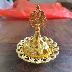 Detail view of Arab luxury gold hollowed incense burner with dome lid and tray set