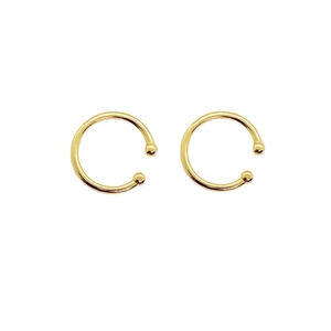 Detailed view of minimalist gold plated S925 sterling silver ear cuffs with ball ends