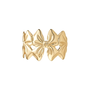 Eleganter goldener Metallarmreif mit strukturiertem Schleifendesign für einen luxuriösen Look