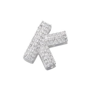 Close-up of silver-plated letter K charm with sparkling pave-set cubic zirconia stones