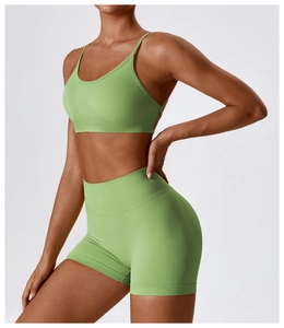 Detail view of avocado green seamless yoga set with racerback top and high waist shorts