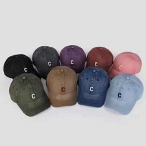 Detailed view of multi-color washed denim baseball caps with 3D embroidered C letters