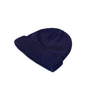 Detailed view of the dark blue ribbed knit pattern on this warm winter beanie hat