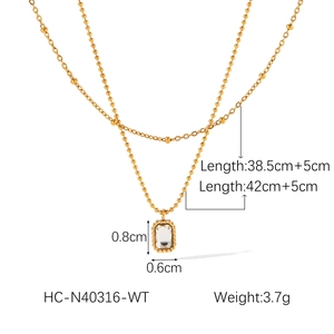 Detailed size chart of a 18k gold double layer necklace with a zircon pendant