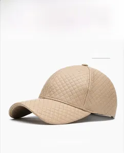 Close-up of khaki PU leather baseball cap featuring diamond quilted stitching detail