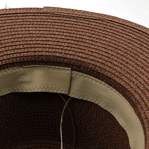 Detail of internal sweatband and fine straw weave on dark brown western cowboy hat