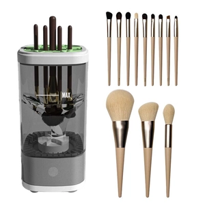 Automatic makeup brush cleaner set with thirteen beige brushes and grey touch-base tank