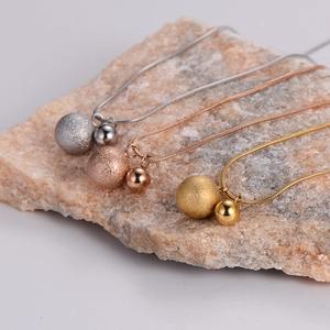 Frosted and polished bead pendants on snake chains in silver, gold, and rose gold finishes