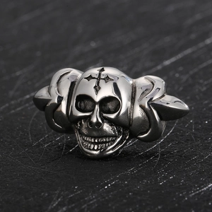 Macro shot of a silver skull bead with wings, detailed punk accessory for leather cords